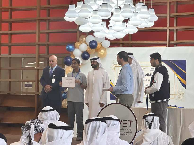 Award ceremony, Saeed receiving a certificate and medal