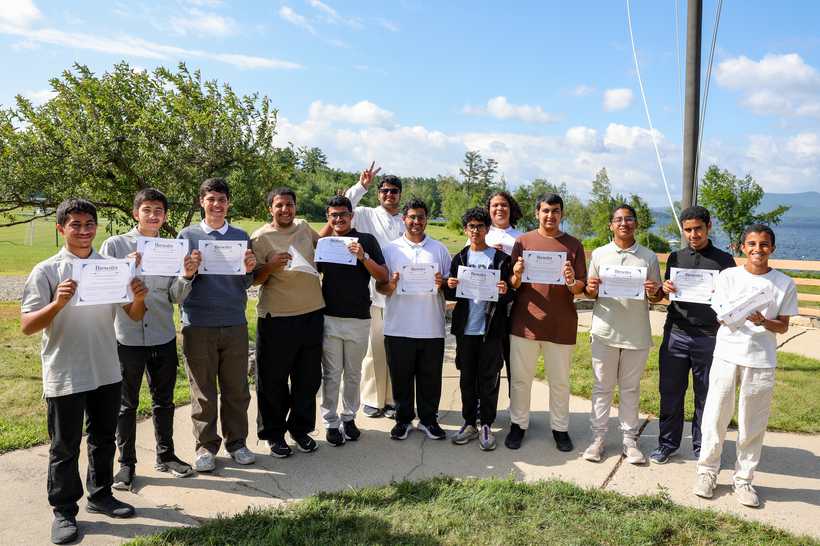 ADIA MustaQbali Program cohort at Brewster Academy, each holding their certificate of participation